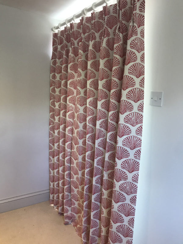 Patterned curtain on a white window frame